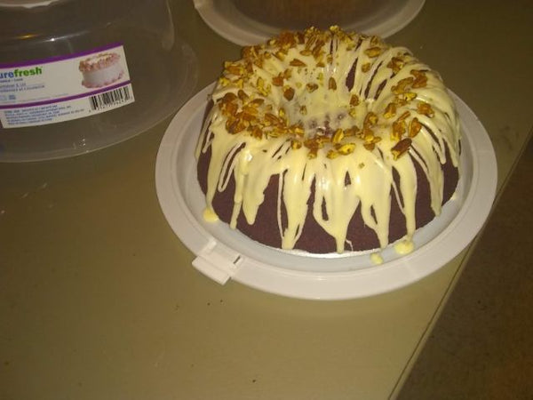 Sour cream pound cake with cream cheese icing and pecans